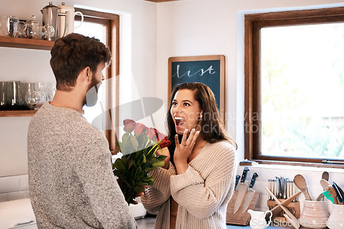 Image of Rose, flower bouquet and happy couple with surprise gift, floral present and flowers for Valentines Day celebration. Home kitchen, wow or romantic man with roses for marriage anniversary or birthday