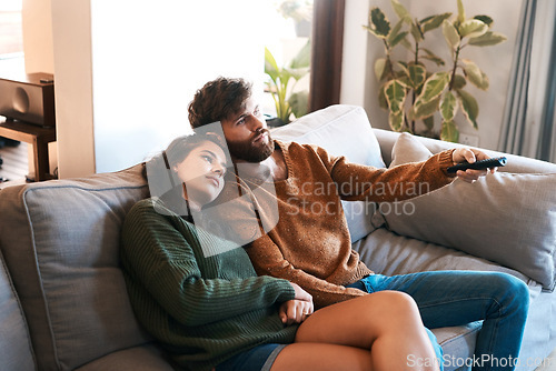 Image of Love, home and relax couple watching tv show, subscription movie or streaming entertainment in living room. Bond, media remote or marriage people watch television, film or video in apartment lounge