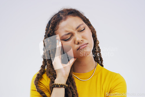 Image of Headache, stress and gen z girl in studio with pain, problem and crisis on mockup or grey background. Temple, anxiety and sad female university student with fear, fatigue or mistake, debt or fail