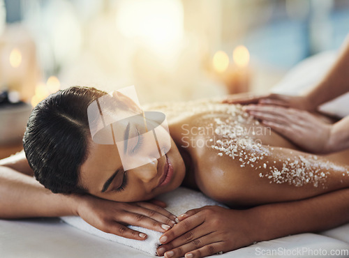 Image of Happy woman, salt scrub and massage back at spa to relax for skincare, exfoliation or self care. Female person, beauty and smile for luxury body treatment, health and wellness with masseuse at salon