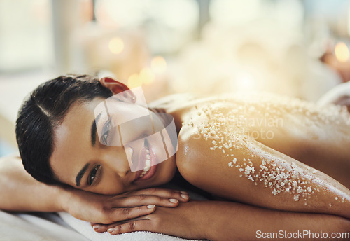 Image of Happy woman, back or portrait at spa in salt scrub for cosmetics treatment, skincare and massage at resort. Face of female person relax on bed for exfoliation, beauty therapy and wellness at salon