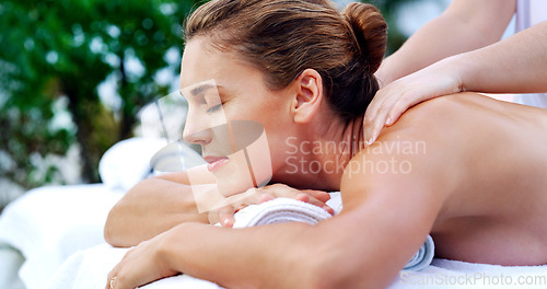 Image of Spa, massage and woman relax with physical therapy, body care and relaxation at a resort. Wellness, peace and lady person with masseuse for luxury, zen and stress free relaxation on Thailand vacation