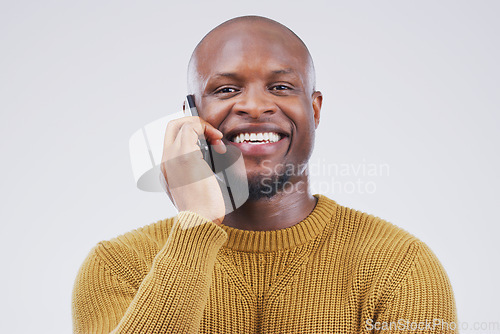 Image of Networking, black man on phone call and happy against a white background. Communication or technology, connectivity on smartphone and African male person smile talking to contact in a studio backdrop