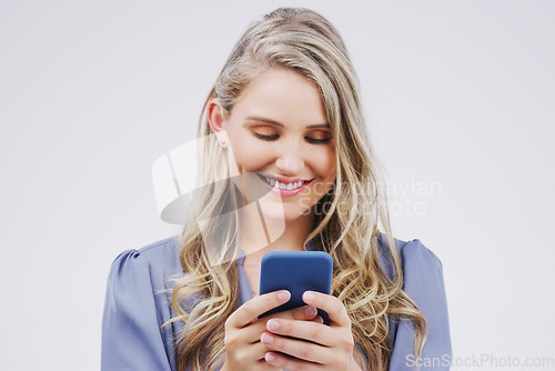 Image of Smartphone, typing and woman in studio with smile for social media, internet and online chat. Communication, white background and happy female person on cellphone for website, mobile app and texting