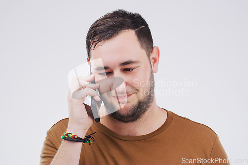 Image of Chat, phone call and man listening in studio isolated on a white background. Calling, cellphone and male person talking, discussion or speaking, conversation and networking with contact on mobile.
