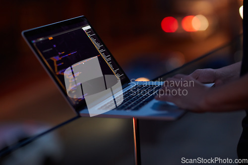 Image of Hacker, code and laptop with hands of person for ransomware, cyber security and phishing. Coding, technology and crime with closeup of programmer for fraud, network system and data scam at night