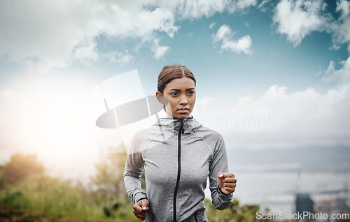 Image of Training, sky and Indian woman with exercise, running and fitness with balance, workout goal and target. Female person, runner or athlete practice, run or energy with focus, concentration or wellness