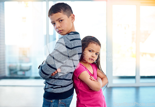 Image of Anger, brother and portrait of sister with arms crossed in home, fighting or argument, conflict or problem. Angry, children and kids with their backs together, frustrated and ignore with mockup.
