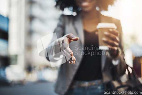 Image of Woman, handshake and meeting in city for greeting, introduction or hiring with coffee outdoors. Hand of female shaking hands for b2b, collaboration or agreement in deal or recruitment in urban town