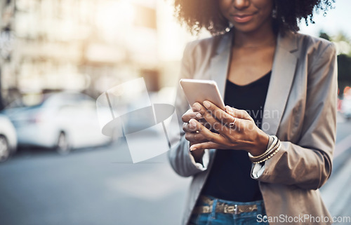 Image of Woman, hands and phone in city for social media, communication or texting outdoors. Hand of business female chatting, online browsing or networking on mobile smartphone in street of an urban town