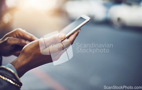 Image of Woman, hands and phone in city for social media, communication or texting on street sidewalk outdoors. Hand of female chatting on mobile smartphone for networking, online browsing or travel in town