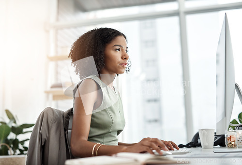 Image of Reading, computer and business woman in office for website management, copywriting or editing online software. Young african person, writer or editor with web article, research and blog on desktop pc