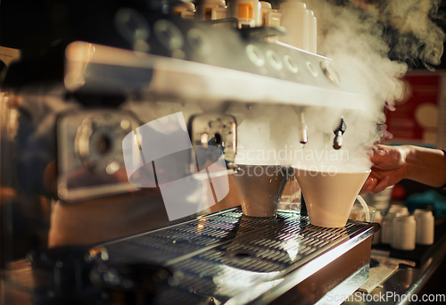Image of Coffee machine, steam and hands of cafe person, barista or diner waiter making beverage, latte drink or espresso. Tea cup, commerce market shop and restaurant store server with morning hot chocolate
