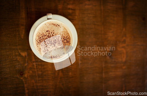 Image of Top view wooden table, coffee cup or mock up cafe store, restaurant or diner for beverage service, drinks or espresso. Hospitality, fresh caffeine mug and desk space with morning hot chocolate latte