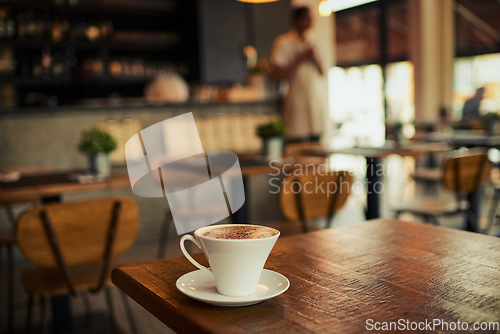 Image of Wooden table, coffee shop mug and cafe store, restaurant or diner for commerce beverage, drink or retail shopping service. Tea cup, morning espresso or startup small business for fresh caffeine sales
