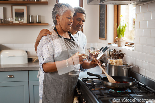 Image of Love, cooking pan and old man with happy woman at oven in kitchen, embrace and healthy marriage bonding in home. Happiness, help and food, senior couple with smile, frying and dinner in retirement.