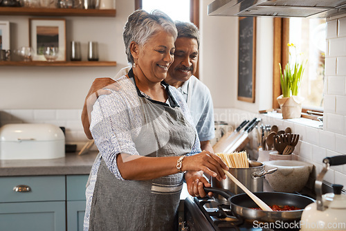 Image of Love, cooking and old man with happy woman at stove in kitchen, embrace and healthy marriage bonding in home. Happiness, help and food in pan, senior couple with smile, hug and dinner in retirement.