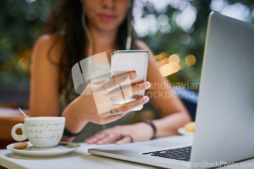 Image of Closeup, laptop and remote work or hand on phone or a message at a cafe and social media. Female person, freelance and communication or searching on device or email on mobile app and at coffee shop.