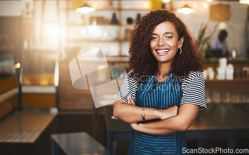 Image of Coffee shop, crossed arms and portrait of woman in cafe for service, working and professional in bistro. Small business owner, restaurant startup and female waiter smile in cafeteria ready to serve