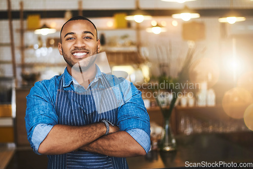 Image of Coffee shop, barista and portrait of happy black man in restaurant for service, working and crossed arms. Small business owner, bistro and professional male waiter smile in cafeteria ready to serve