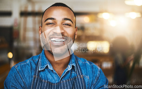 Image of Coffee shop, restaurant and portrait of black man waiter for service, working and happy in cafe. Small business owner, barista startup and confident male worker smile in cafeteria ready to serve