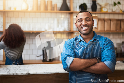 Image of Cafe, crossed arms and portrait of black man barista for service, working and coffee shop startup. Small business owner, restaurant and professional male waiter smile in cafeteria ready to serve