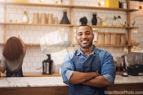 Image of Coffee shop, crossed arms and portrait of black man in cafe for service, working and restaurant startup. Small business owner, professional barista and male waiter smile in cafeteria ready to serve