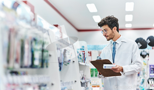 Image of Pharmacist, medicine and man with a clipboard in pharmacy to check stock of products in retail store. Male person, pharmaceutical and medical industry for service, healthcare and inventory on shelf