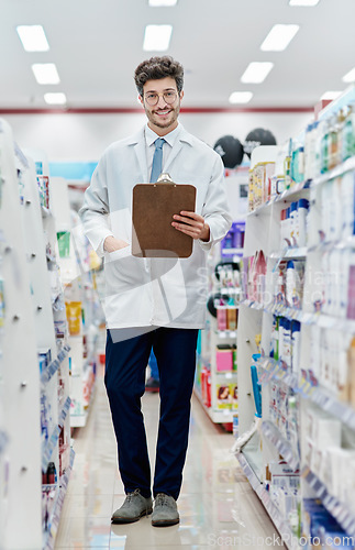 Image of Pharmacist, medicine and portrait of a man with a clipboard in pharmacy store for retail career. Happy male person in pharmaceutical or medical industry for service, healthcare and inventory on shelf