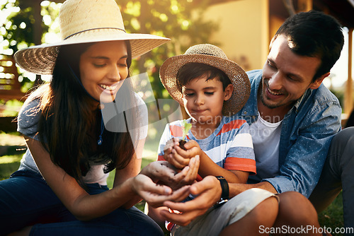 Image of Happy family, plants or parents with child in garden for sustainability, agriculture or farming development. Mother father or boy hands holding sand or planting for teaching a child farming skills