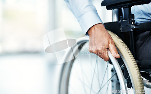 Image of Wheelchair, person with disability and hand in a hospital for healthcare and support. Patient, mobility access and male adult in a clinic for supporting and medical care with hands and mockup space