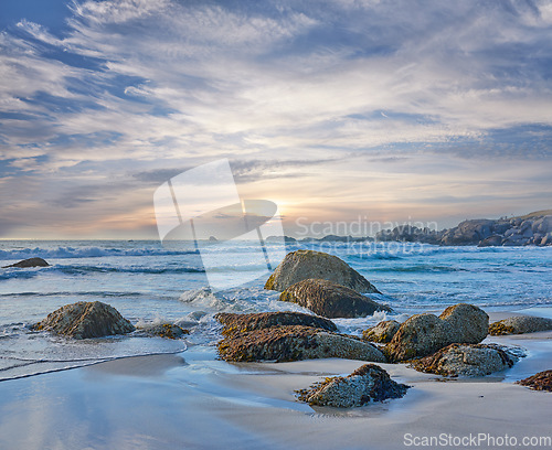 Image of Rocks, beach and landscape with travel and ocean, environment and holiday destination in South Africa. Coastal location, nature and outdoor with seascape and tropical adventure with sea waves