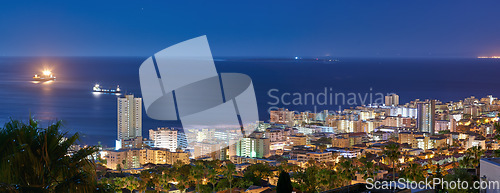 Image of Cityscape, buildings and urban landscape at night, skyline and location with architecture, landmark and travel. City, skyscraper and banner with Cape Town view, rooftop and tourism with destination