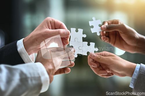 Image of Puzzle, business hands and group of people for solution, teamwork and goals, integration or workflow success. Team building, games and development of person problem solving, synergy or collaboration