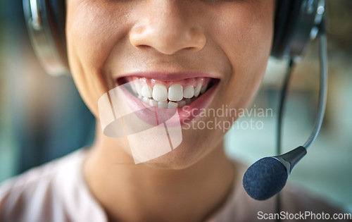 Image of Happy woman, teeth and smile in call center with headphones for customer service or telemarketing. Closeup of friendly female person or consultant agent mouth smiling with headset mic to contact us