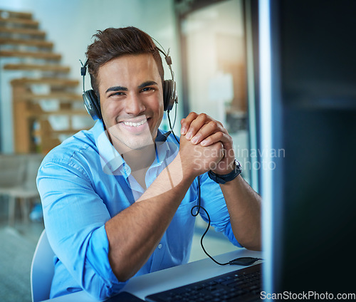 Image of Happy businessman, call center and portrait of consultant in customer service, support or telemarketing at office. Friendly man or consulting agent with smile and headphones by computer at workplace