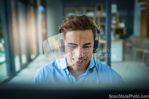 Image of Happy businessman, call center and consulting with headphones for customer service, support or telemarketing at office. Friendly man person or consultant agent smiling for online advice in contact us