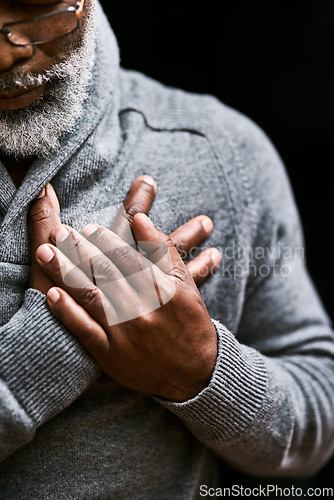 Image of Hands on chest, heart attack and senior black man with medical emergency in studio isolated on a background. Pain, cardiology and African male person with cardiac arrest, heartburn or stroke problem.