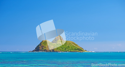 Image of Blue water, tropical island and Hawaii with clear sky in summer in nature on holiday. Natural background, sunshine and sunrise at the ocean and beach of Oahu outdoor with calm sea and mockup space
