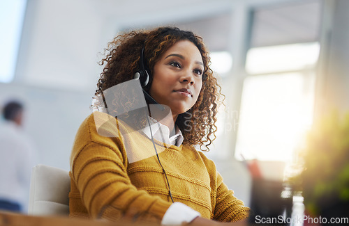 Image of African woman, call center agent or customer service with focus, listen or voip communication for consulting. Female consultant, tech support or crm for contact, headphones or microphone at help desk