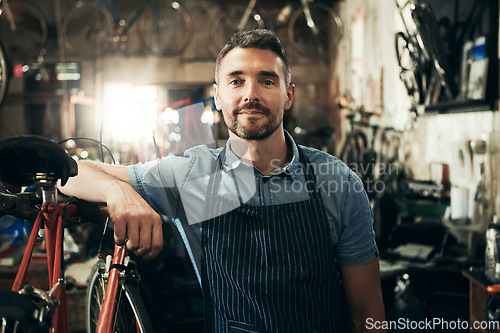 Image of Portrait, serious and repair man in bicycle shop working in store or cycling workshop. Face, bike mechanic and confident male person, business owner or mature professional technician from Australia.