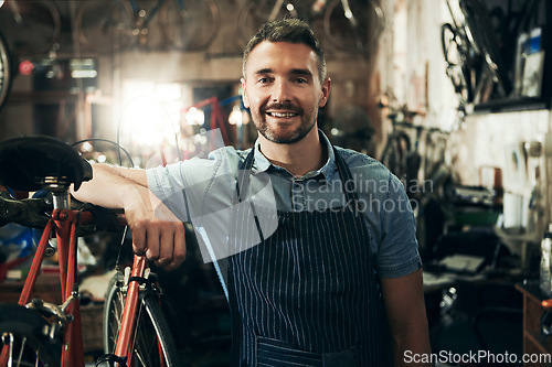 Image of Portrait, smile and repair man in bicycle shop working in store or cycling workshop. Face, bike mechanic and confident male person, business owner or mature professional technician from Australia.