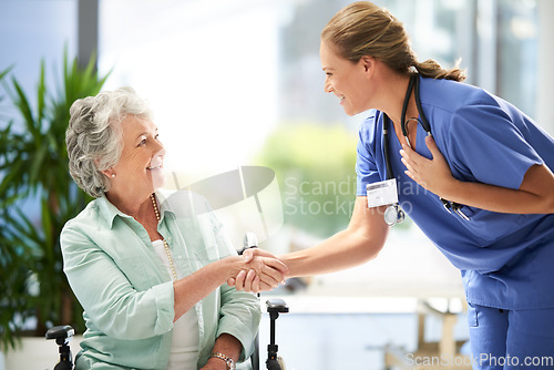 Image of Handshake, nurse and senior advice in wheelchair with medical results and surgery success news. Hospital, healthcare and clinic with women and nursing staff with care and support of elderly person