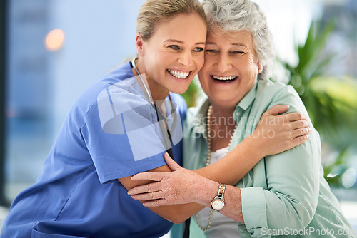 Image of Nurse laugh, senior woman and hug of caregiver and happy smile with support and care in hospital. Wellness, women and healthcare employee help with elderly female patient with love in a clinic