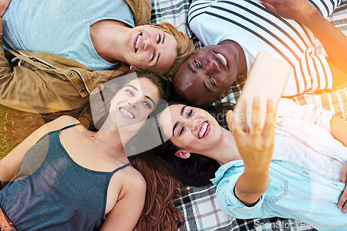 Image of Friends, top view and picnic with circle selfie, happiness or diversity for social media post, app or blog. Men, woman and students for photography, profile picture or solidarity with lying on ground