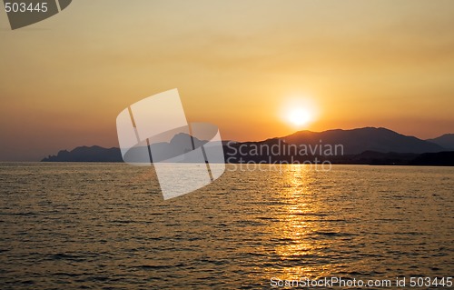 Image of Sunset over the sea and mountains. Ukraine. Coast of Crimea.