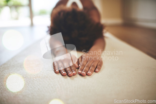 Image of Woman, meditation and stretching body on yoga mat for mindfulness, zen or spiritual wellness on floor at home. Calm female meditating or warm up stretch for relaxation, mind and healthy wellbeing