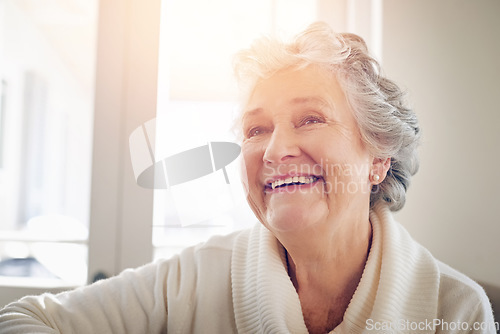 Image of Relax, happy and smile with old woman on sofa for free time, retirement and weekend. Lens flare, happiness and mindset with senior person in living room at home for elderly, positive and carefree