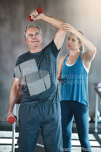 Image of Physiotherapy, dumbbell and fitness with old man and personal trainer for support, health and workout. Training, weightlifting or coaching with senior patient and physiotherapist for elderly exercise