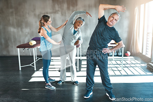 Image of Stretching, physiotherapy and old couple with personal trainer for fitness, wellness and helping. Health, workout and retirement with senior patient and physiotherapist in class for warm up training